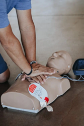 Person learning CPR.